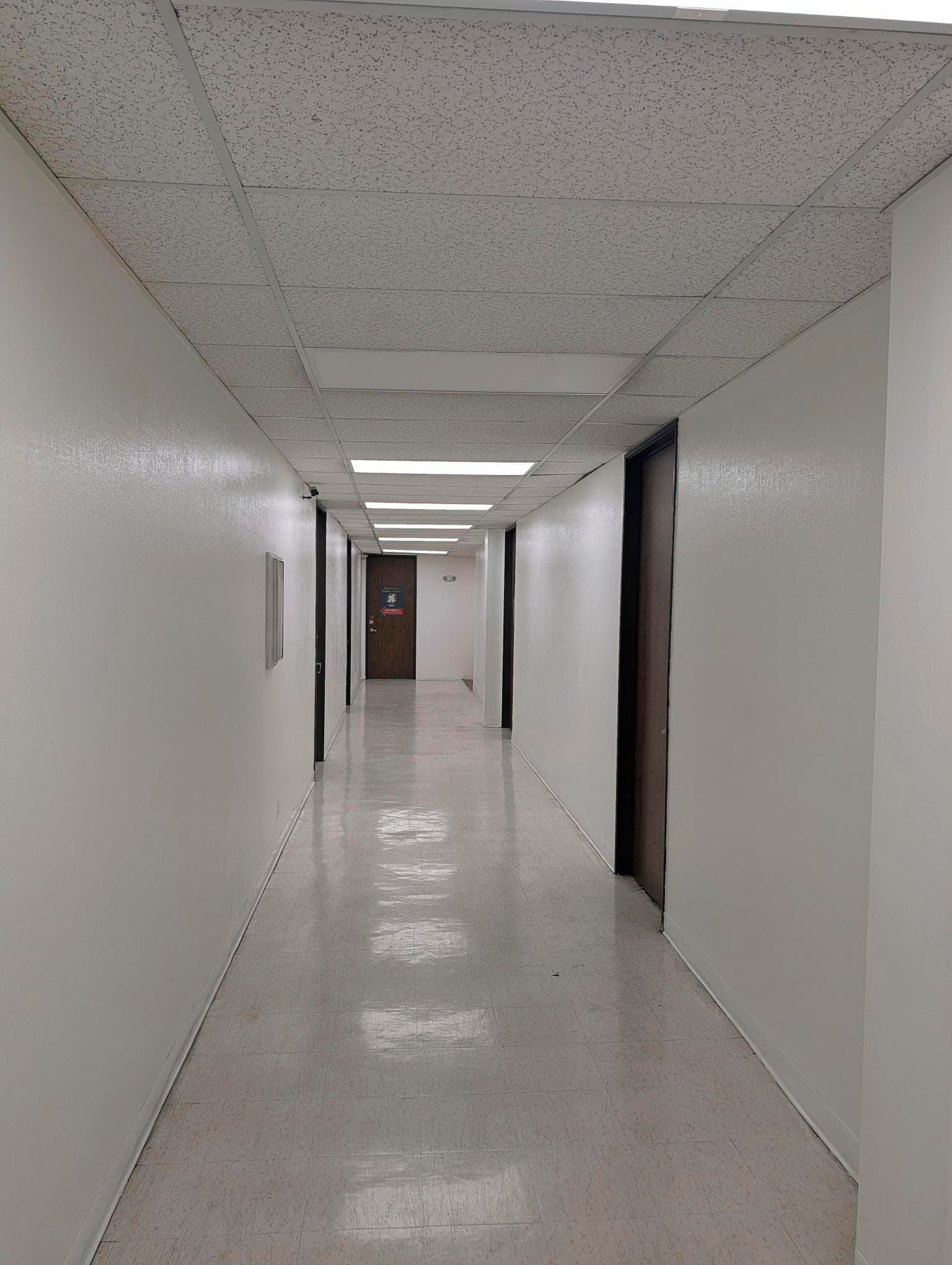 Second-floor corridor looking toward the Suite 205 door