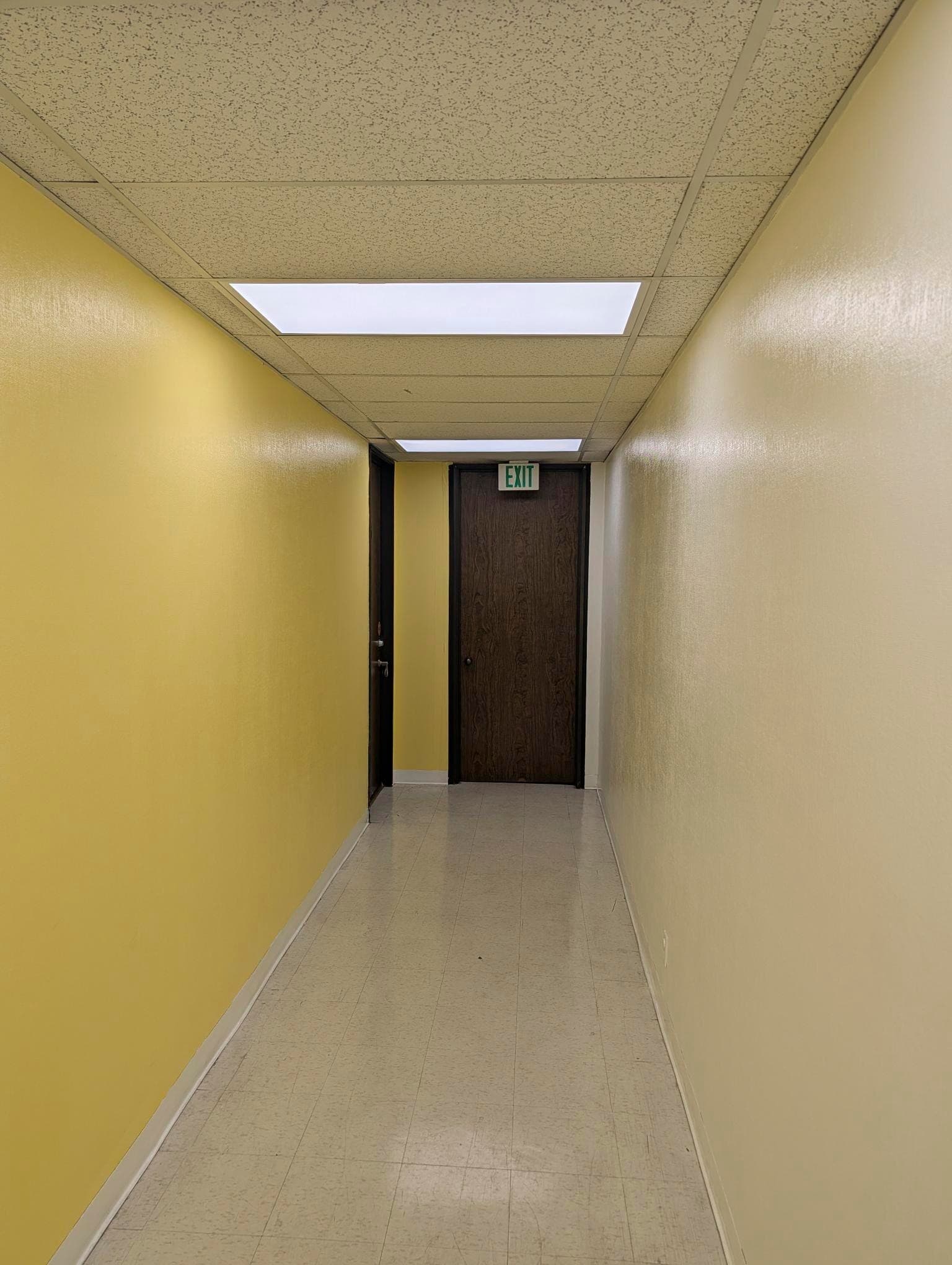 Interior hallway with yellow accent wall on the second floor