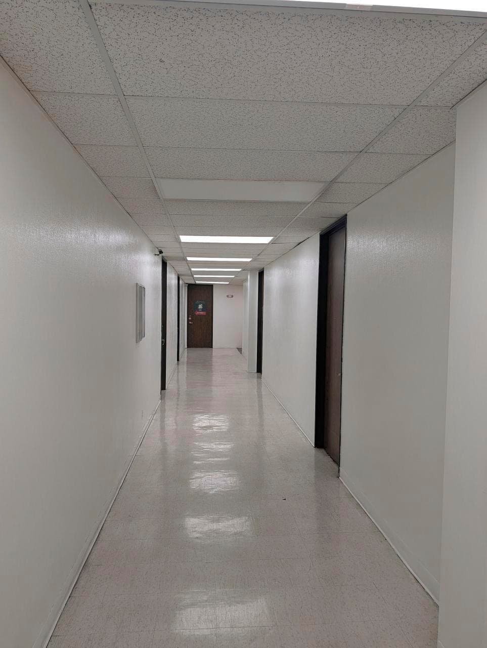 Second-floor corridor toward windowed offices