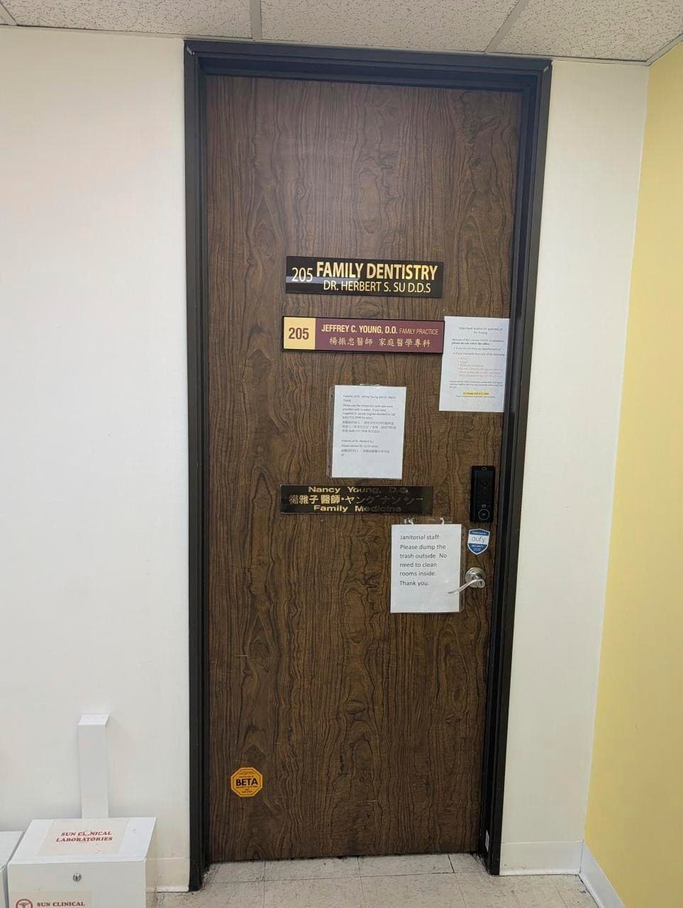 Suite 205 door — Family Dentistry / family practice nameplates still on the door from prior occupants