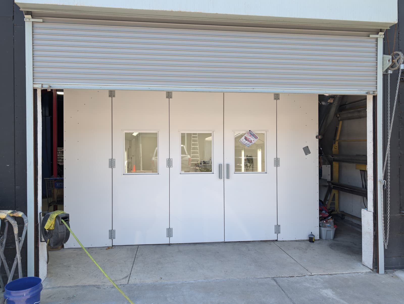 Enclosed paint and spray booth — collision-repair infrastructure