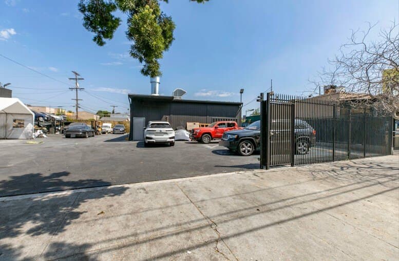 Gated street frontage and entry yard at 4605 W Pico Blvd